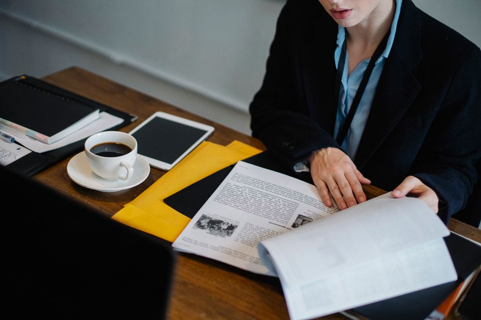 Business professional reviewing loan agreement carefully to avoid common financing mistakes