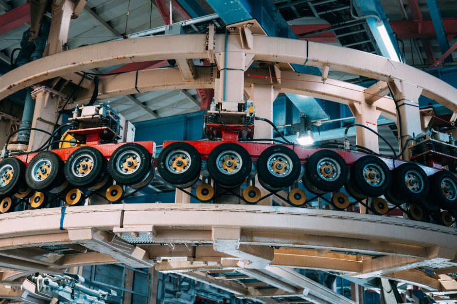 Modern manufacturing equipment being installed in a bright industrial facility