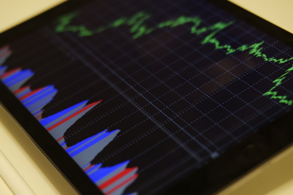 Business leader analyzing market data and financial forecasts during economic uncertainty